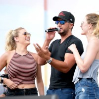 Luke Bryan surprises two fans with tickets to his concert tonight at Nissan stadium during the 2018 CMA Music festival at the Chevy Riverfront Stage...