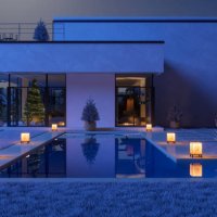 luxury villa decorated with christmas tree, gift boxes and ornaments in snowy weather at night - garden decoration stock pictures, royalty-free photos & images