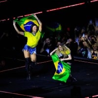 Madonna and Brazilian singer Pabllo Vittar show Brazilian flags on stage during a massive free show to close 