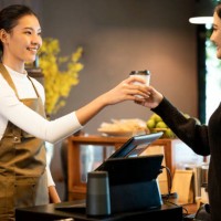 make me happy with drinks coffee. young asian women coffee shop owner serving black coffee to her customers in a cafe. service mind, point of sale system, and take-out foods. - junk food stock pictures, royalty-free photos & 