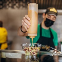 male chef preparing salad - junk food stock pictures, royalty-free photos & images