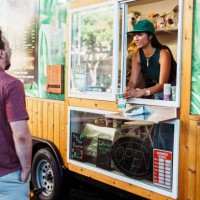 male customers smiles while receiving drink from barista - junk food stock pictures, royalty-free photos & images
