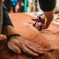 male fashion designer working in workshop - fashion stock pictures, royalty-free photos & images