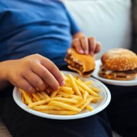 male hands eating french fries - junk food stock pictures, royalty-free photos & images