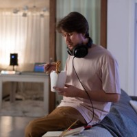 male musician eating delivery food - junk food stock pictures, royalty-free photos & images