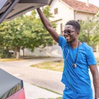 male nurse standing outdoors - travel stock pictures, royalty-free photos & images