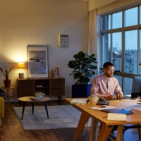 male professional using computer at apartment - home decoration stockfoto's en -beelden