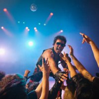 male rock star on stage interacting with audience - concert stock pictures, royalty-free photos & images