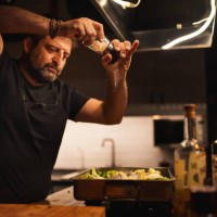 man adding spice from the salt grinder to the food - food stock pictures, royalty-free photos & images