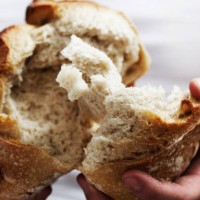 man breaking bread - food stock pictures, royalty-free photos & images