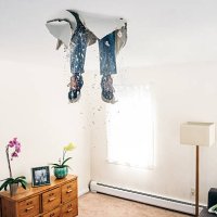 man breaks ceiling drywall while doing diy - home decoration stock pictures, royalty-free photos & images