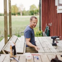 man building a patio outside his country side house - home decoration stock pictures, royalty-free photos & images
