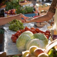 man buying vegetables at outdoors market stall - food stock pictures, royalty-free photos & images