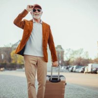 man carrying suitcase - travel stock pictures, royalty-free photos & images
