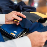 man checking fabric swatches - fashion stock pictures, royalty-free photos & images