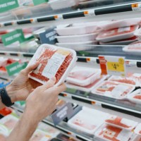 man checks price of ground beef at supermarket - food stock pictures, royalty-free photos & images