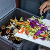 man composting organic remains in home composter - food stock pictures, royalty-free photos & images