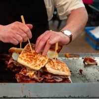 man cooking sandwiches - junk food stock pictures, royalty-free photos & images