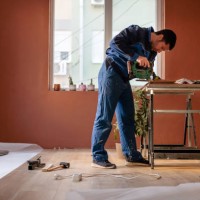 man cutting laminate - home decoration stock pictures, royalty-free photos & images