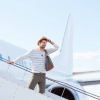 man disembarking a flight - fashion stock pictures, royalty-free photos & images