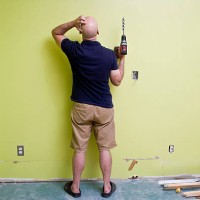 man doing home improvements with a power drill - home decoration stock pictures, royalty-free photos & images