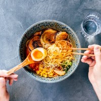 man eating tonkotsu ramen, personal perspective directly above view - food stock pictures, royalty-free photos & images