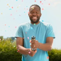 man exploding confetti - garden decoration stock pictures, royalty-free photos & images