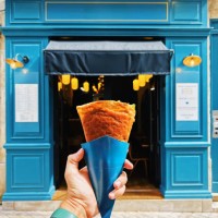 man holding crepe on the street in paris, france - junk food stock pictures, royalty-free photos & images