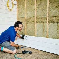 man installing siding during home improvement project - home decoration stock pictures, royalty-free photos & images