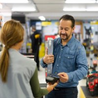 man making a contactless payment at a hardware store - home decoration stock pictures, royalty-free photos & images