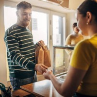 man paying for lunch - junk food stock pictures, royalty-free photos & images