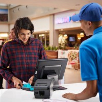 man paying for movie tickets at lobby - junk food stock pictures, royalty-free photos & images