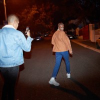 man photographing friend on smart phone at street - fashion stock pictures, royalty-free photos & images