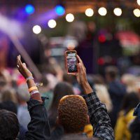 man photographing through mobile phone with friends - concert stock pictures, royalty-free photos & images