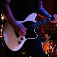 man playing electric guitar on the stage at the rock concert - concert stock pictures, royalty-free photos & images
