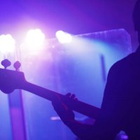 man playing guitar on stage - concert stock pictures, royalty-free photos & images