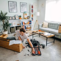 man portrait and do it yourself furniture assembly - home decoration stock pictures, royalty-free photos & images