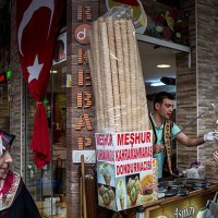 Man sells Turkish ice cream to a customer on a market street in Eminonu on September 26, 2016 in Istanbul, Turkey. Credit rating agency Moody's...