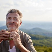 man smiling while holding sandwich - food stock pictures, royalty-free photos & images
