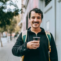 man with takeaway coffee - junk food stock pictures, royalty-free photos & images