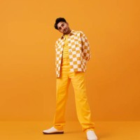 man with vitiligo standing with hands behind back - fashion stock pictures, royalty-free photos & images