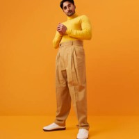 man with vitiligo standing with hands clasped - fashion stock pictures, royalty-free photos & images