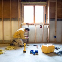 man working in construction site, side view - home decoration stock pictures, royalty-free photos & images
