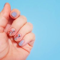 manicured hand with a leaf design at nail polish - nails art stock pictures, royalty-free photos & images