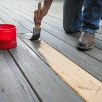 mans hand painting deck close up - home decoration stock pictures, royalty-free photos & images