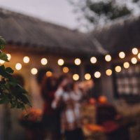 many light bulbs on the wire. lighting in the cafe. garland of lamps - garden decoration stock pictures, royalty-free photos & images