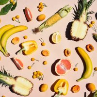 many yellow fruits and vegetables on a yellow background. - food stock pictures, royalty-free photos & images