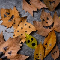maple leaf with painted face as decoration for autumn halloween holiday celebration. halloween party in october. - home decoration stock pictures, royalty-free photos & images