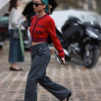 Margaret Zhang is seen outside Chanel show wearing black Chanel sunnies, red and lilac Chanel cropped Cardigan, low waist grey pants and black ballet...