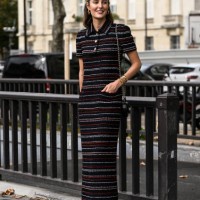 Maria de la Orden is seen wearing a Chanel knit dress, black Chanel bag and white and pink flats outside the Chanel show during the Womenswear...